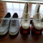 An image showing a a skater measuring shoe size to convert to skate size
